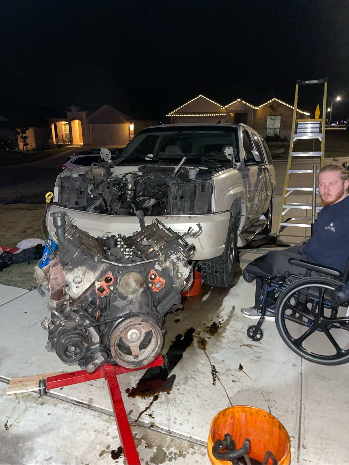 Pulling the 6.0 out of the Escalade donor in the driveway